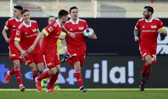 Union's Max Kruse holds the ball as he celebrates after scoring his side's first goal during the German Bundesliga soccer match between 1. FC Union Berlin and 1. FC Cologne in Berlin, Germany, Saturda ...