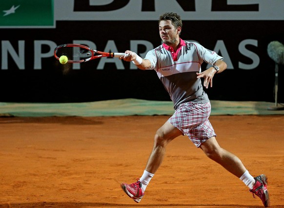 epa04750371 Stan Wawrinka of Switzerland in action against Rafael Nadal of Spain during their quarter final match of the Italian Open tennis tournament at the Foro Italico in Rome, Italy, 15 May 2015. ...