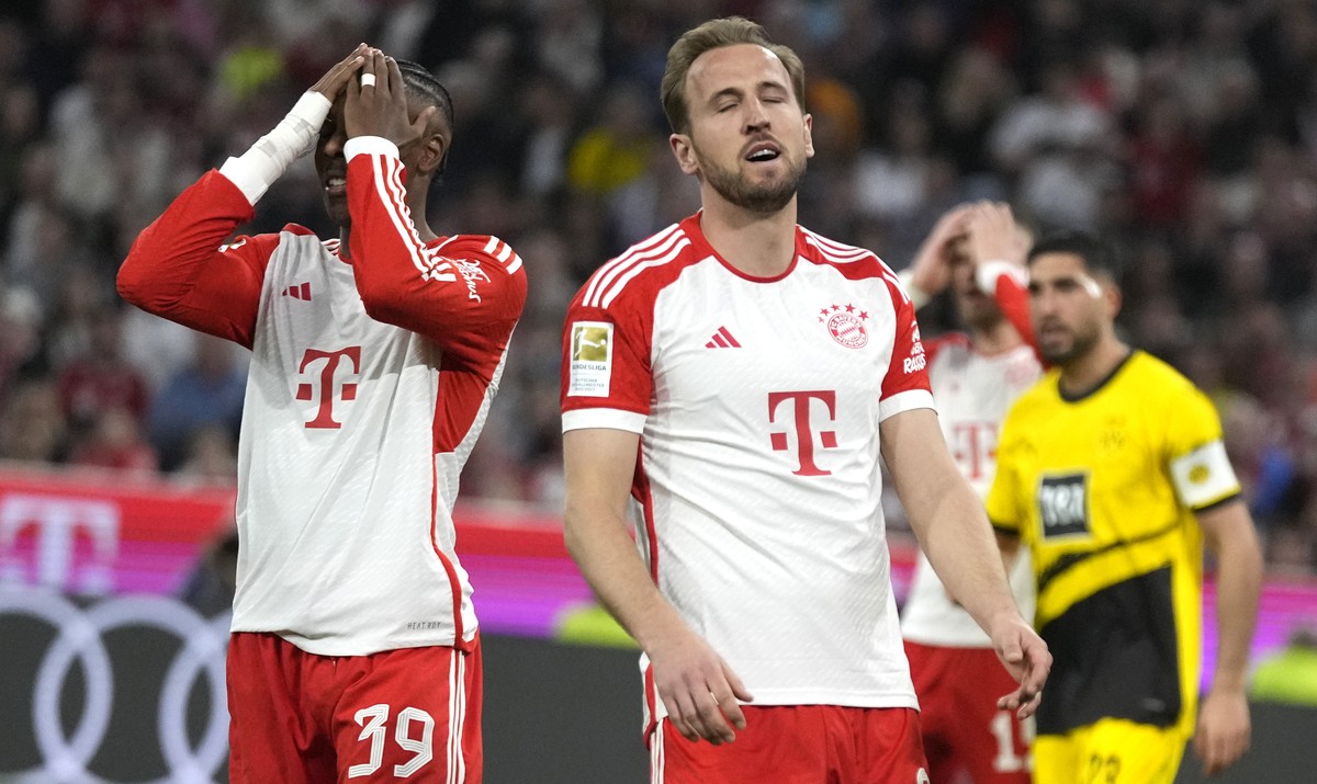 Bayern's Mathys Tel, left, and Bayern's Harry Kane react during the German Bundesliga soccer match between FC Bayern Munich and Borussia Dortmund at the Allianz Arena stadium, in Munich, Ger ...