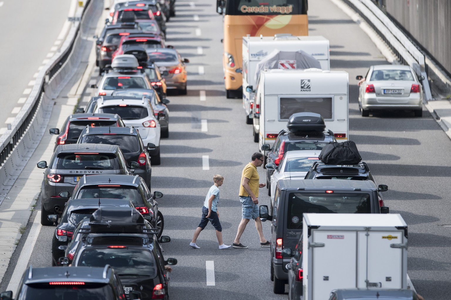 A traffic jam in Erstfeld, Switzerland, in front of the Gotthard tunnel with a length up to 14 kilometres, on Saturday, 14 July 2018. The summer holidays begin this weekend throughout Switzerland and  ...
