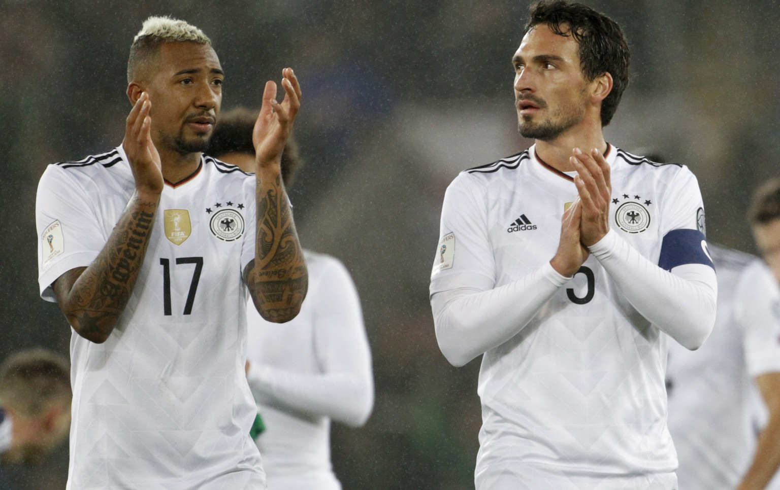 Germany&#039;s, from left, Jerome Boateng and Mats Hummels applaud their supporters after the World Cup Group C qualifying soccer match between Northern Ireland and Germany at Windsor Park in Belfast, ...