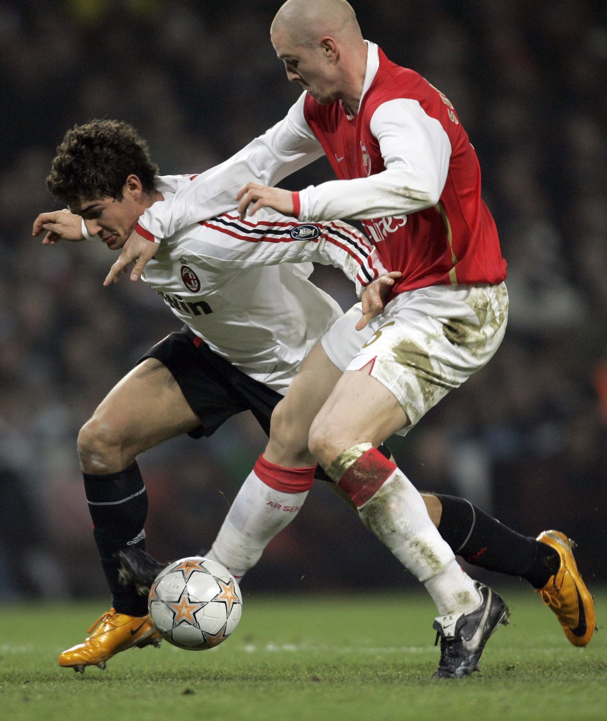 Arsenal's Philippe Senderos, right, vies for the ball with AC Milan's Pato, left, during their Champions League round of 16 soccer match at the Emirates Stadium in London, Wednesday, Feb. 20 ...
