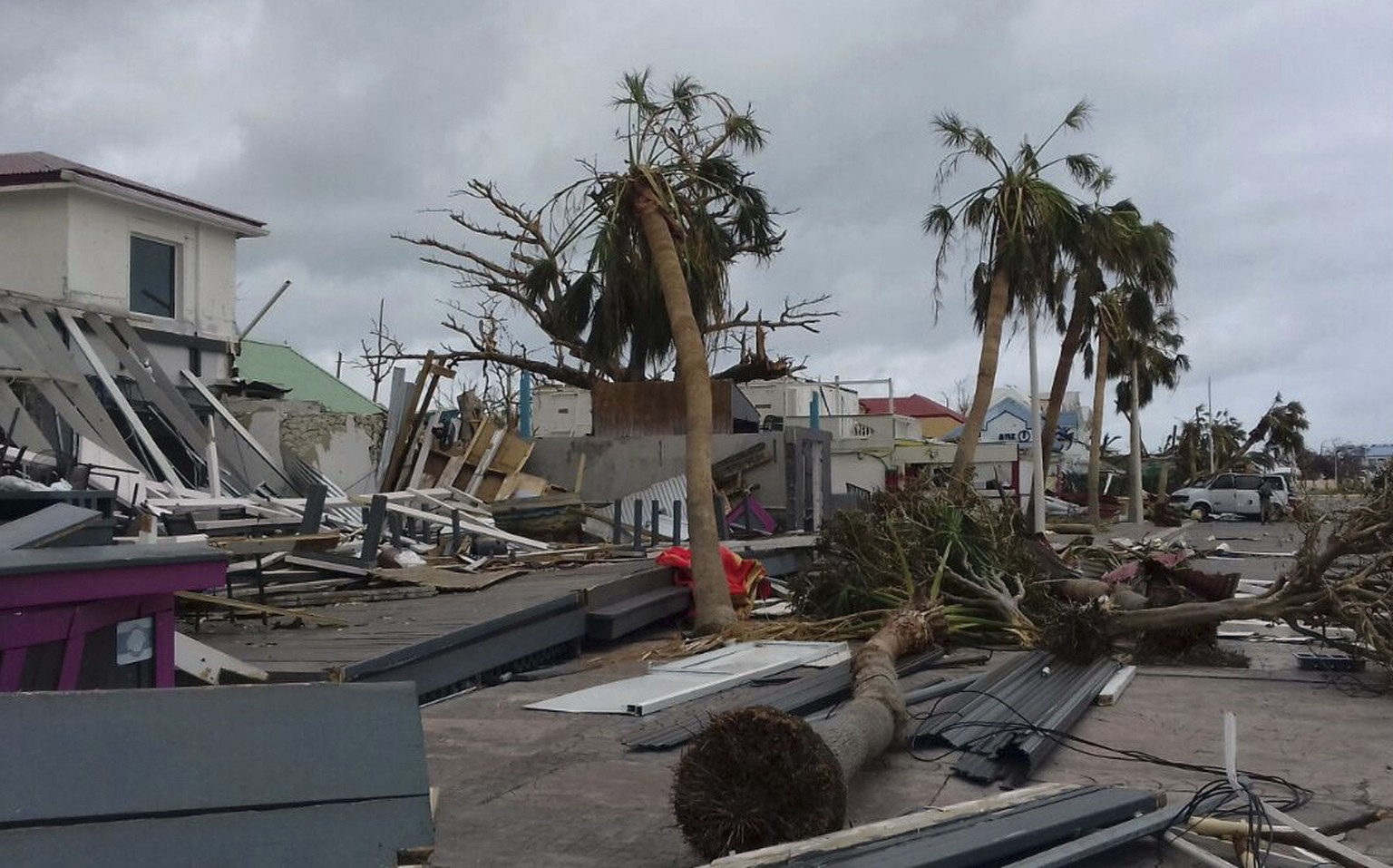 Damaged buildings and fallen trees litter downtown Marigot, on the island of St. Martin, after the passing of Hurricane Irma, Saturday, Sept. 9, 2017. On the Dutch side of St. Martin, an island divide ...