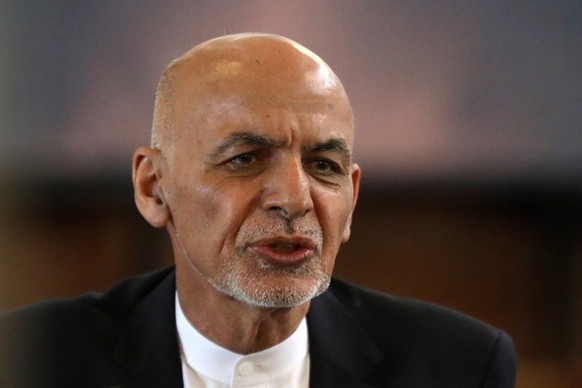 epa09415350 (FILE) - Afghanistan President Ashraf Ghani speaks during celebrations to mark the Persian New Year Nowruz at the presidential palace in Kabul, Afghanistan, 21 March 2021 (reissued 15 Augu ...