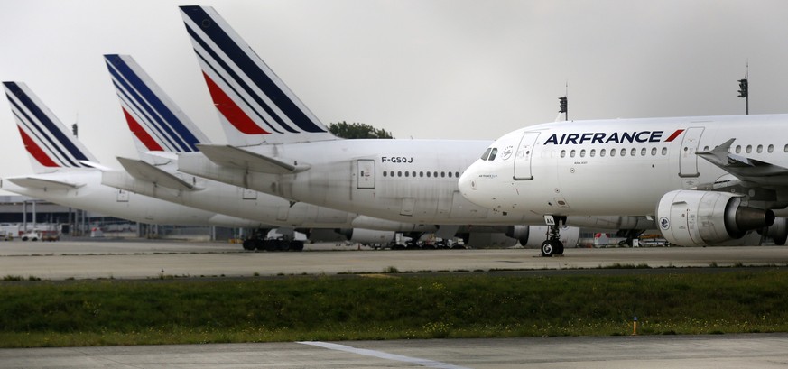 Air France planes are parked on the tarmac at the Charles de Gaulle International Airport in Roissy, near Paris on the second week of a strike by Air France pilots September 22, 2014. SNPL, the main F ...