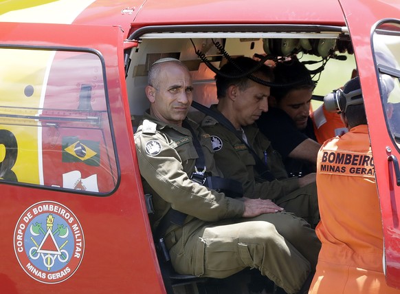 Golan Vach, Israeli chief commander who came to help with rescue missions, boards a helicopter at the site where a dam collapsed in Brumadinho, Brazil, Monday, Jan. 28, 2019, as more than 100 Israeli  ...