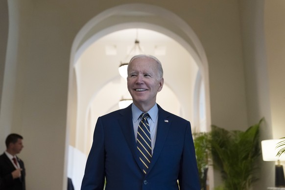 President Joe Biden smiles as he speaks about democratic control of the Senate before leaving his hotel to attend the Association of Southeast Asian Nations (ASEAN) summit, Sunday, Nov. 13, 2022, in P ...