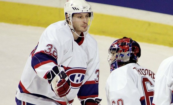 Montreal Canadiens Mark Streit, left, goaltender Jose Theodore and Alexander Perezhogin react following the winning goal by Buffalo Sabres Brian Campbell during overtime NHL action to lose to the Sabr ...