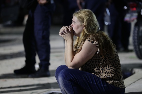 epa13062507 A woman laments in Caracas, Venezuela, 24 June 2026. Two powerful earthquakes struck Venezuela, including a magnitude 7.5 earthquake, causing buildings to collapse as authorities assessed  ...