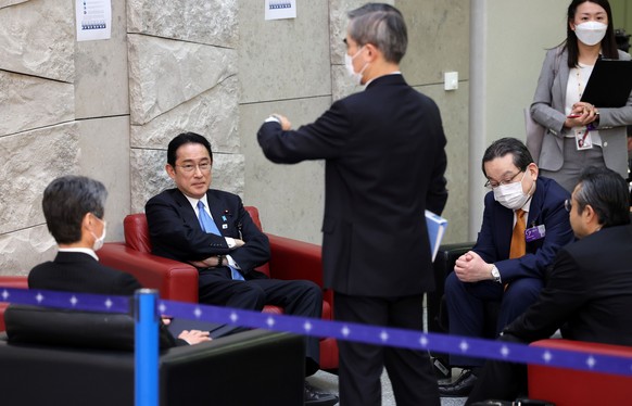 Japan&#039;s Prime Minister Fumio Kishida, second left, waits prior to a meeting of the Group of Seven at NATO headquarters in Brussels, Thursday, March 24, 2022. The Group of Seven meet Thursday on t ...