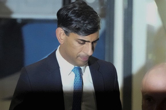 Britain&#039;s Prime Minister Rishi Sunak looks down as he leaves the COVID Inquiry at Dorland House after giving evidence in London, Monday, Dec. 11, 2023. Sunak was Chancellor of the Exchequer durin ...