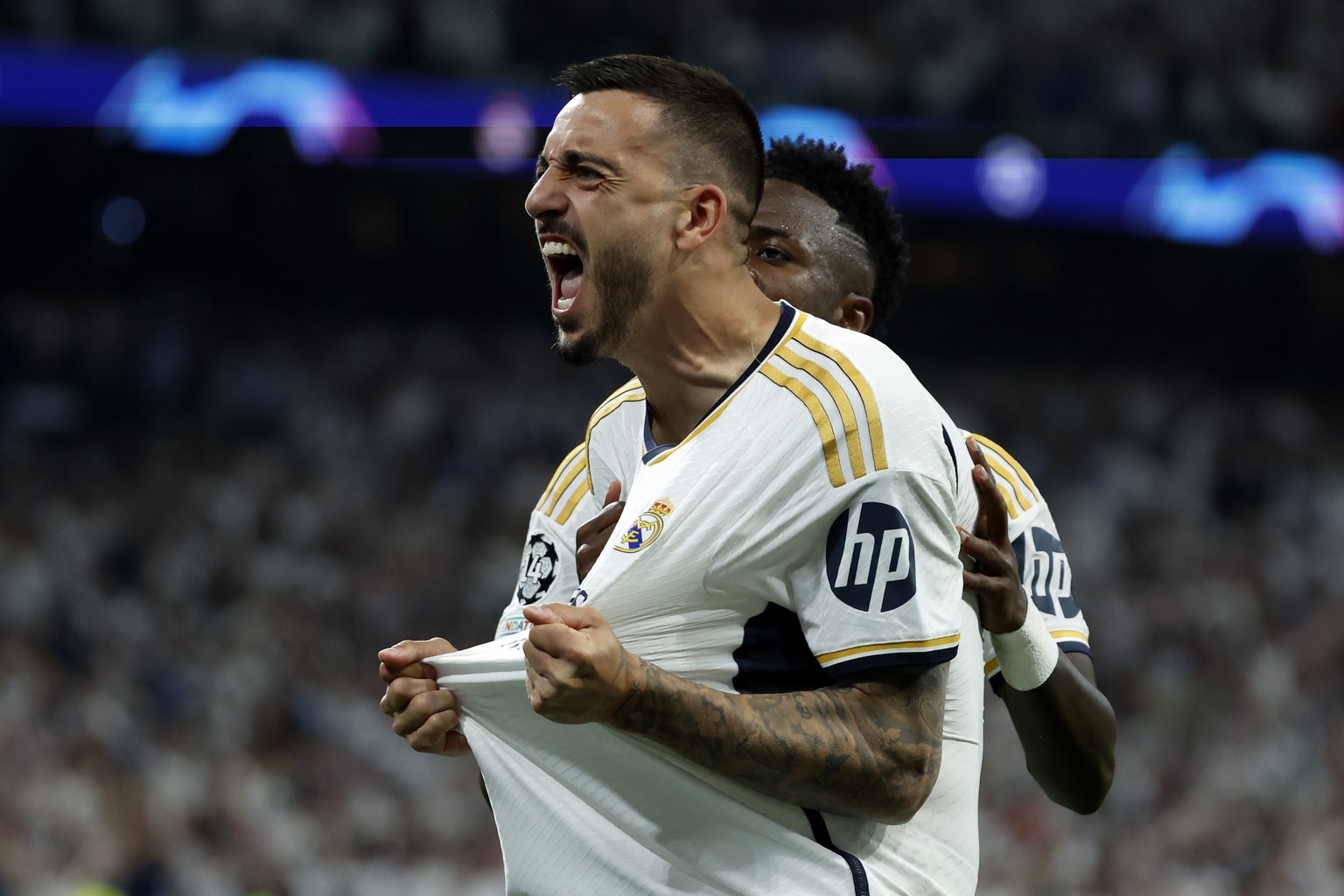 epa11327918 Joselu of Real Madrid celebrates after scoring the 1-1 goal during the UEFA Champions League semifinal second leg soccer match between Real Madrid and Bayern Munich, in Madrid, Spain, 08 M ...