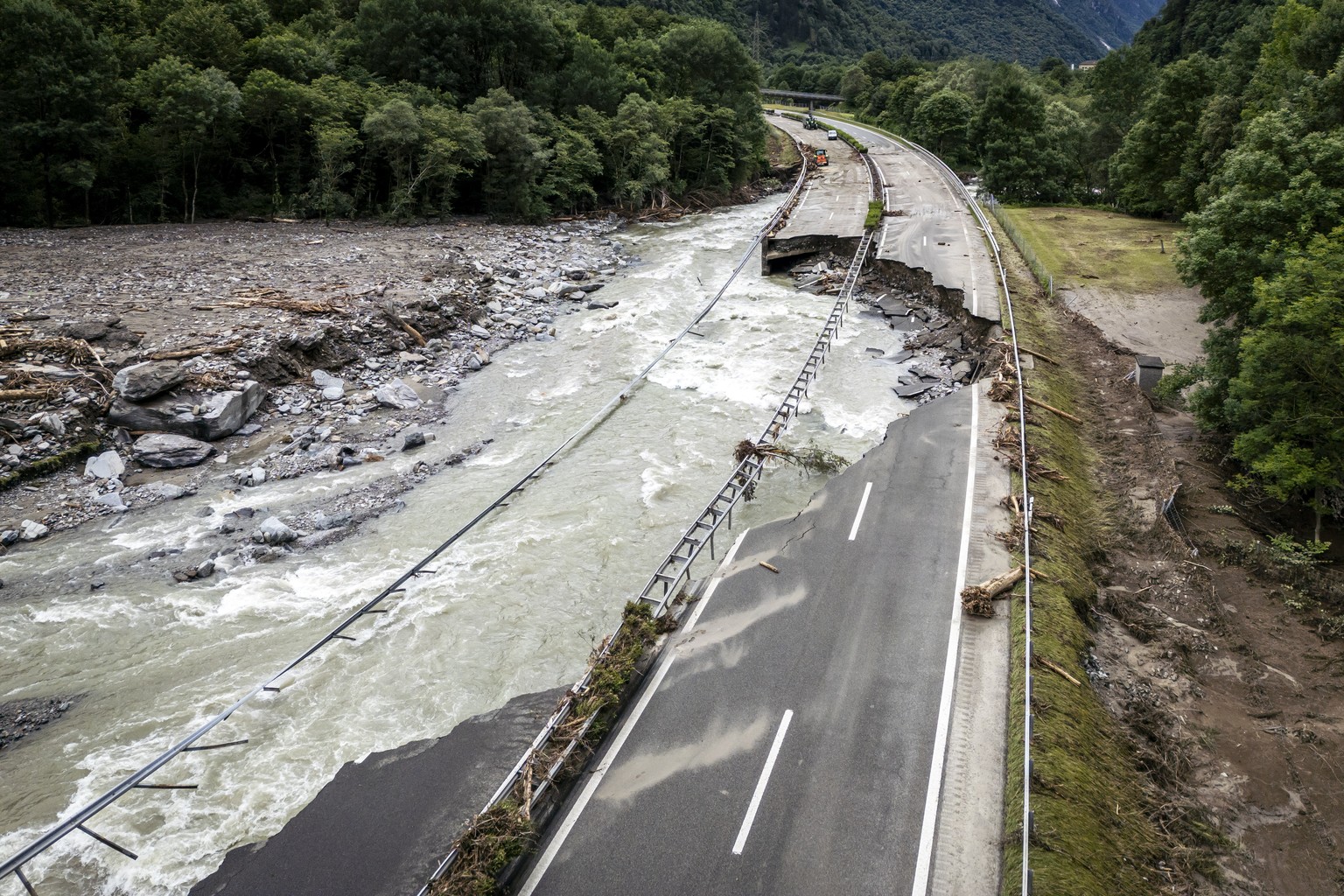 epa11431917 The highway A13 between Lostallo and Soazza destroyed by the force of the Moesa river, caused by heavy rain in the Misox valley, in Lostallo, southern Switzerland, 23 June 2024. Massive th ...
