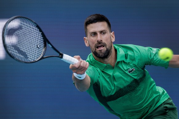 epa11984539 Novak Djokovic of Serbia in action against Camilo Ugo Carabelli of Argentina during their Men?s Singles 3rd round match at the 2025 Miami Open tennis tournament in Miami, Florida, USA, 23  ...