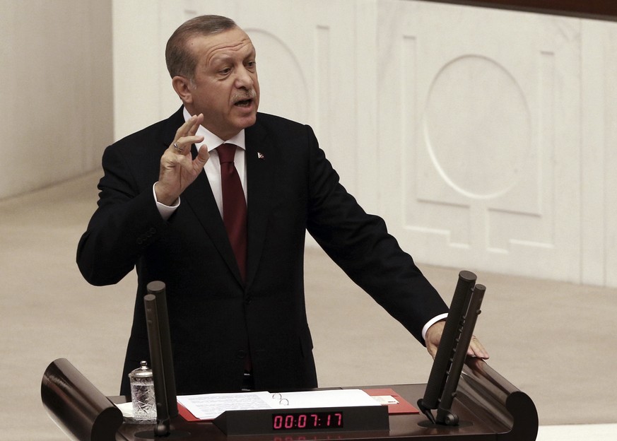 Turkey&#039;s President Recep Tayyip Erdogan addresses the parliament in Ankara, Turkey, Saturday, Oct. 1, 2016. Erdogan hinted on Thursday that the three-month state of emergency declared following t ...