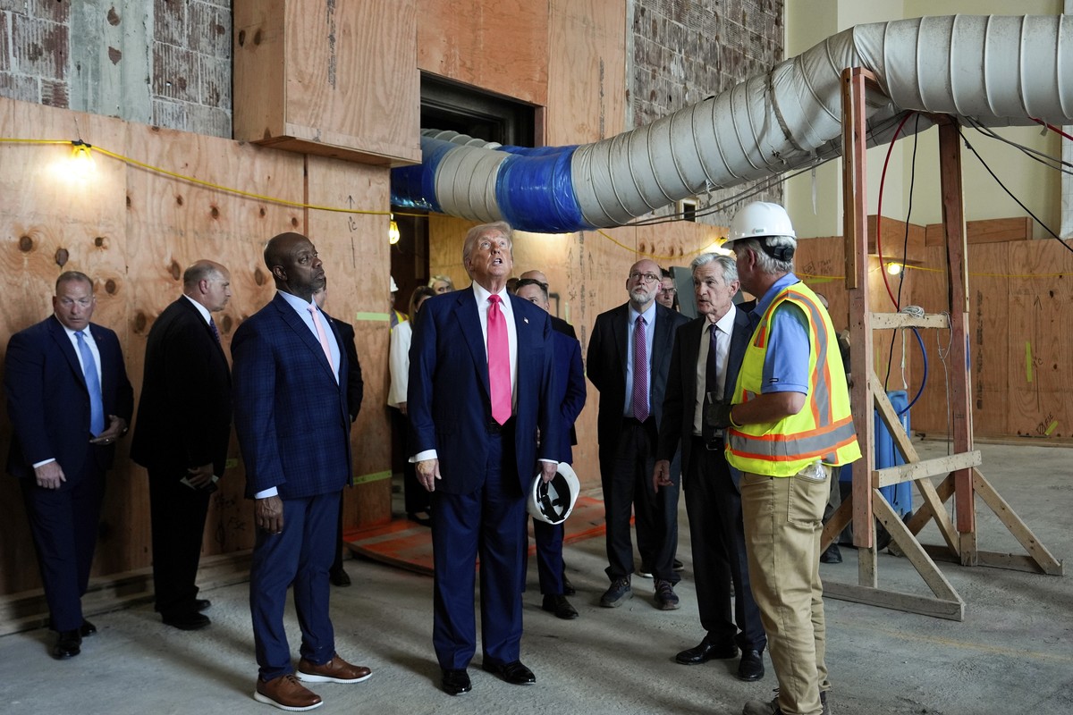 Sen. Tim Scott, R-S.C., from foreground left, President Donald Trump and Federal Reserve Chairman Jerome Powell visit the Federal Reserve, joined by Russell Vought, director of the Office of Managemen ...