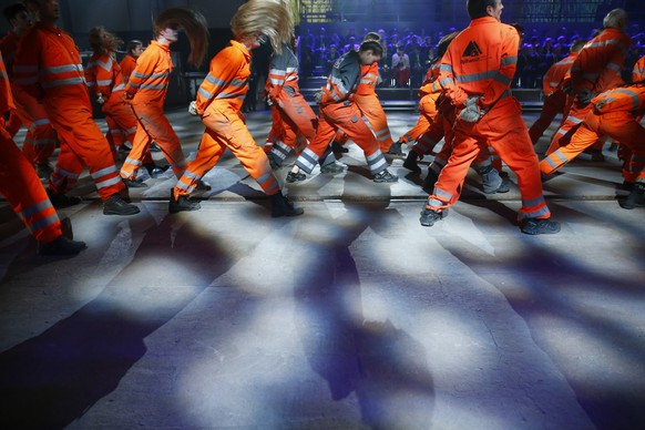 Artists perform during the opening show directed by german director Volker Hesse, on the opening day of the Gotthard rail tunnel, the longest tunnel in the world, at the fairground Rynaecht at the nor ...