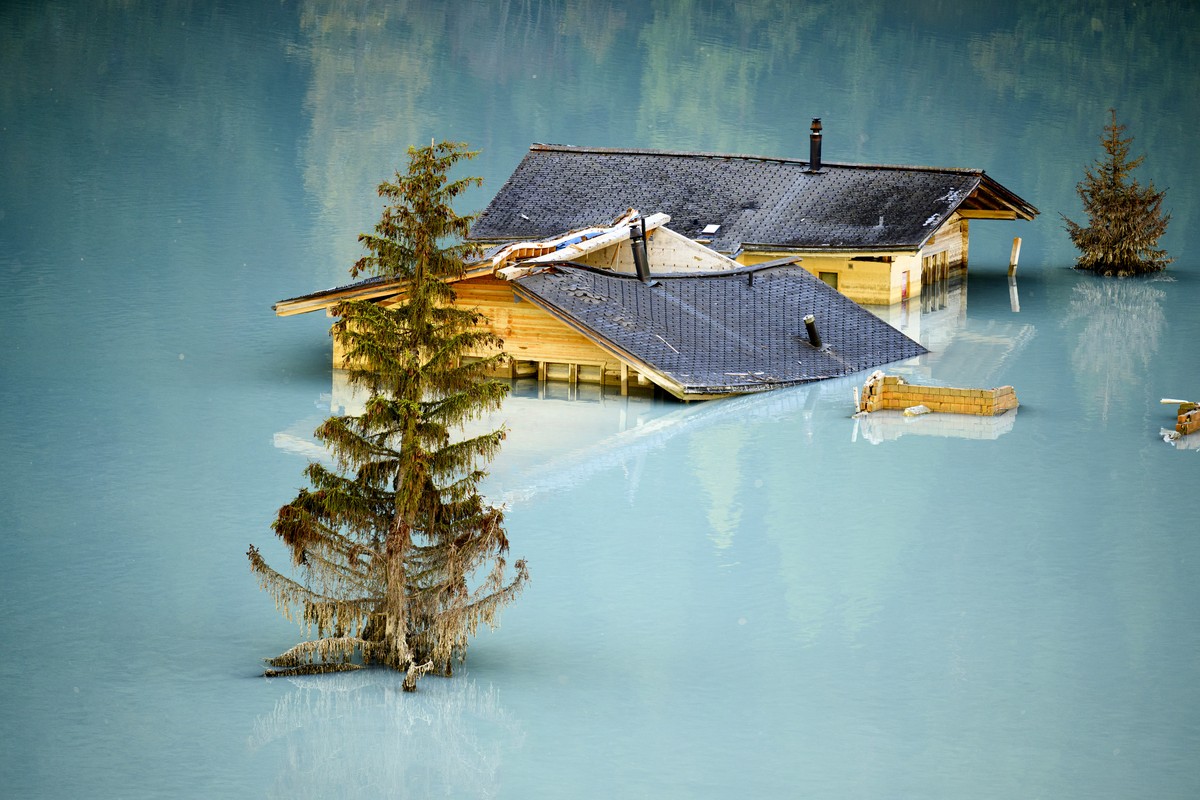 KEYPIX - Destroyed and flooded houses are pictured during the groundbreaking ceremony of reconstruction the village, project "Blatten 2030", 3,5 months after a landslide destroyed the villag ...