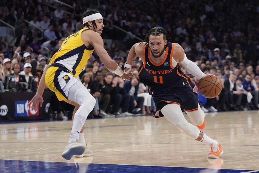 New York Knicks&#039; Jalen Brunson (11) drives past Indiana Pacers&#039; Andrew Nembhard (2) during the second half of Game 2 in an NBA basketball second-round playoff series, Wednesday, May 8, 2024, ...