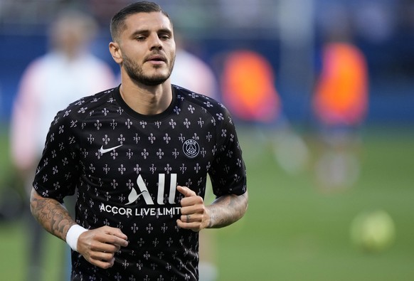 PSG's Mauro Icardi runs during the warm up before the French League One soccer match between Troyes and Paris Saint Germain, at the Stade de l'Aube, in Troyes, France, Saturday, Aug. 7, 2021. (AP Phot ...