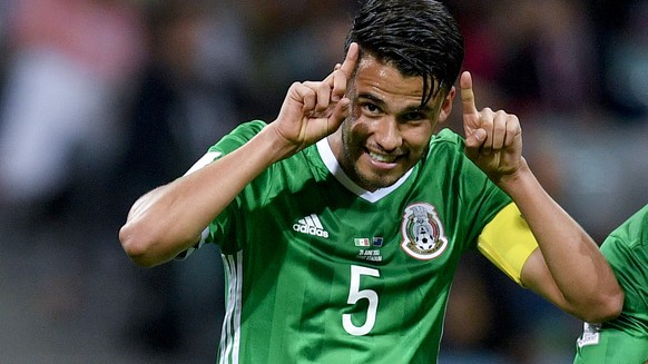 Mexico&#039;s Raul Jimenez, right, celebrates with his teammate Diego Reyes after scoring during the Confederations Cup, Group A soccer match between Mexico and New Zealand, at the Fisht Stadium in So ...