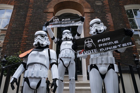 epa07733588 Protesters dressed as stormtroopers with placards &#039;Vote Darth Vader for Prime Minister&#039; outside the offices of Britain&#039;s Former Foreign Secretary Boris Johnson in Central Lo ...
