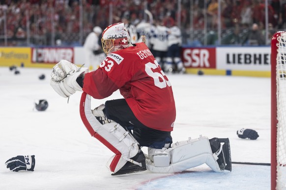 epa13007584 Switzerland's goaltender Leonardo Genoni looks disappointed after losing the 2026 IIHF Men's Ice Hockey World Championship gold medal game between Switzerland and Finland, in Zur ...