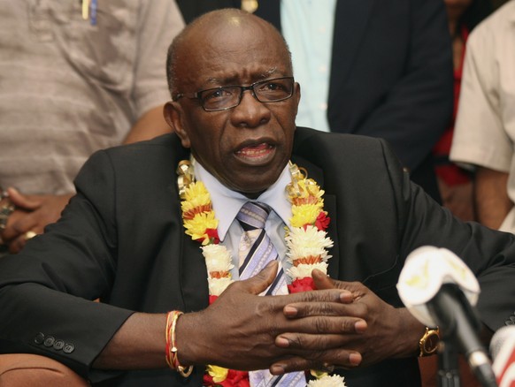 FILE - In this June 2, 2011, file photo, suspended FIFA executive Jack Warner gestures during a news conference at the airport in Port-of-Spain, Trinidad and Tobago. The former Caribbean soccer offici ...