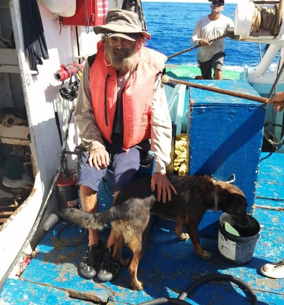 epa10752415 A handout photo made available by Grupomar shows Australian Timothy Lyndsay Shaddock and his dog Bella after being rescued by a Grupomar vessel in the Pacific Ocean, Mexico, 17 July 2023.  ...