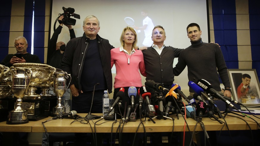 epa09677273 Serbian tennis player Novak Djokovic&#039;s uncle Goran (L), mother Diana (2-L), father Srdjan (2-R), and brother Djordje (R) pose for photographers during a press conference in Belgrade,  ...