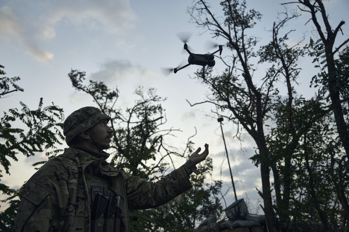 A soldier of Ukraine's 3rd Separate Assault Brigade launches a drone near Bakhmut, the site of fierce battles with the Russian forces in the Donetsk region, Ukraine, Sunday, Sept. 3, 2023. (AP Ph ...