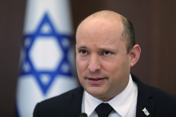 FILE - Israeli Prime Minister Naftali Bennett attends a cabinet meeting at the prime minister&#039;s office in Jerusalem, Israel Sunday, Oct. 24, 2021. Israeli lawmakers are set to begin marathon voti ...