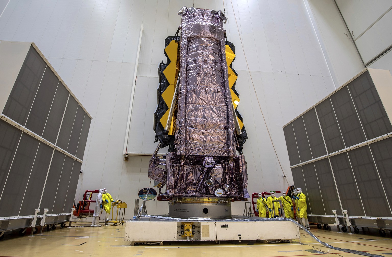 In this Saturday, Dec. 11, 2021 photo released by the European Space Agency, NASA���s James Webb Space Telescope is secured on top of the Ariane 5 rocket that will launch it to space from Europe���s S ...