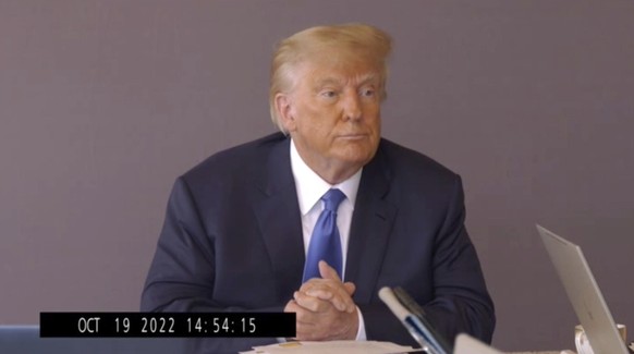 In this image taken from video released by Kaplan Hecker &amp; Fink, former President Donald Trump pauses during his Oct. 19, 2022, deposition for his trial against writer E. Jean Carroll. The video r ...