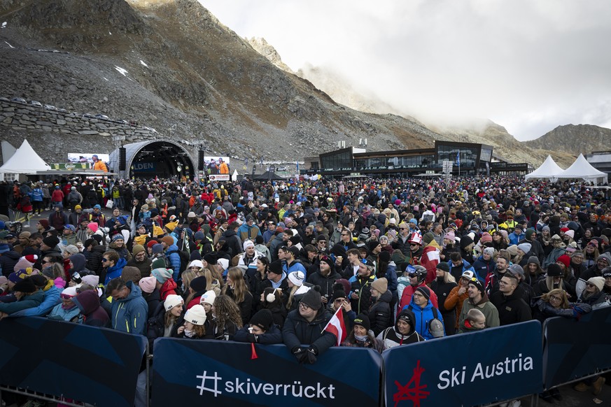 Spectators wait the start of the second run of the Women's Giant Slalom race of the FIS Alpine Skiing World Cup season opener on the Rettenbach glacier, in Soelden, Austria, Saturday, October 26, ...
