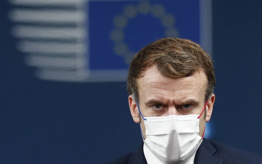 French President Emmanuel Macron arrives for an EU Summit at the European Council building in Brussels, Thursday, Dec. 16, 2021. European Union leaders meet for a one-day summit Thursday that will cen ...