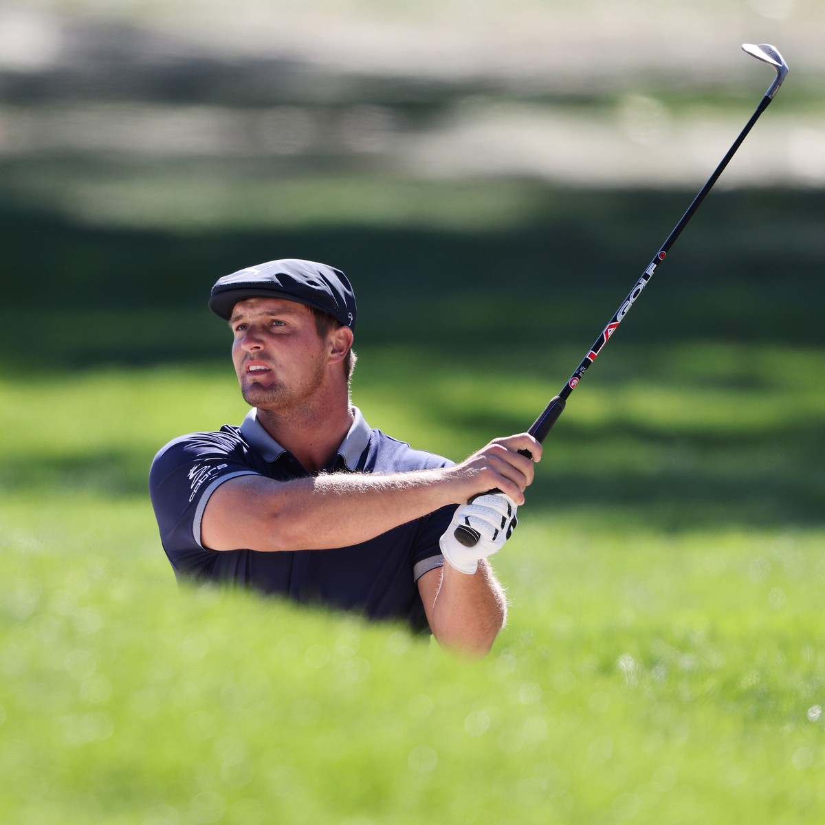 epa08682631 Bryson DeChambeau of the US hits out of a bunker on the first hole during the third round of the 2020 US Open at Winged Foot Golf Club in Mamaroneck, New York, USA, 19 September 2020. The  ...