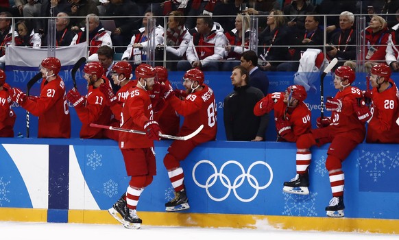 epa06548931 Mikhail Grigorenko (C) of Olympic Athletes from Russia celebrates a goal against Norway during the mens play-offs Quarterfinals match inside the Gangneung Hockey Centre at the PyeongChang  ...