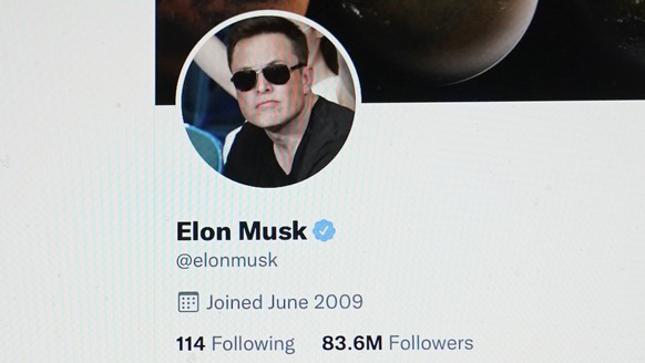 FILE - The Twitter page of Elon Musk is seen on the screen of a computer in Sausalito, Calif., on Monday, April 25, 2022. Elon Musk wants to change how Twitter doles out its checkmark badges for verif ...