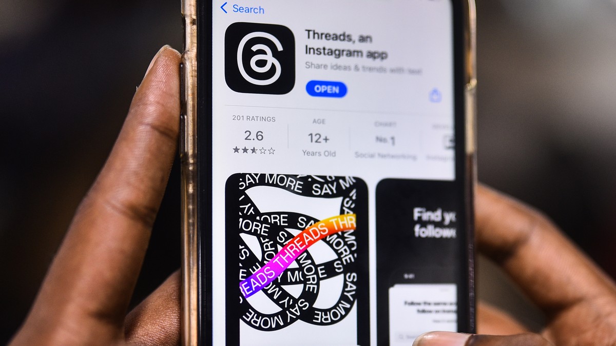 epa10732129 An employee downloads the newly unveiled Threads app on an iPhone at a design company in Chennai, India, 07 July 2023. Meta, the company behind Facebook and Instagram, said in a press rele ...