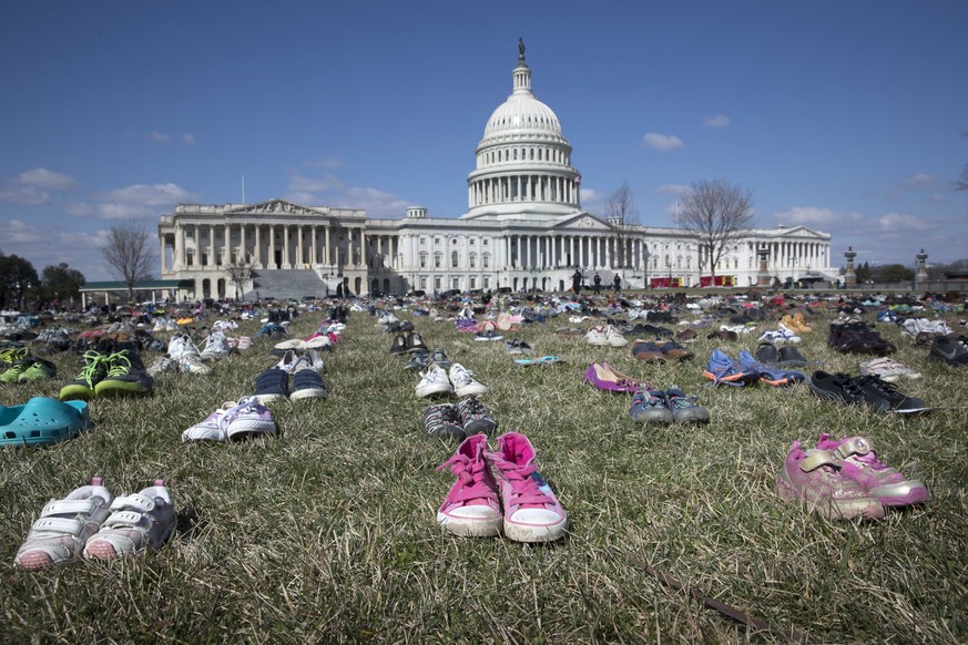 epaselect epa06601073 Approximately seven thousand shoes representing lost children to guns since the 14 December 2012 shooting at Sandy Hook Elementary School in Newtown, Connecticut, are seen on the ...