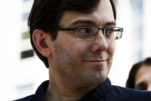 epa06567474 (FILE) - Martin Shkreli, former chief executive of Turing Pharmaceuticals, stands with his attorney Benjamin Brafman (out of frame)during a press conference at the United States federal co ...