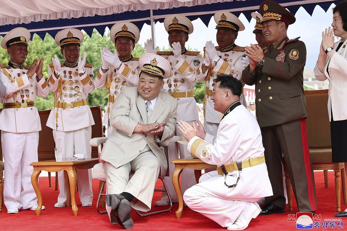 In this photo provided by the North Korean government, North Korea leader Kim Jong Un, front left, attends a launching ceremony of what is says a new nuclear attack submarine "Hero Kim Kun Ok&quo ...