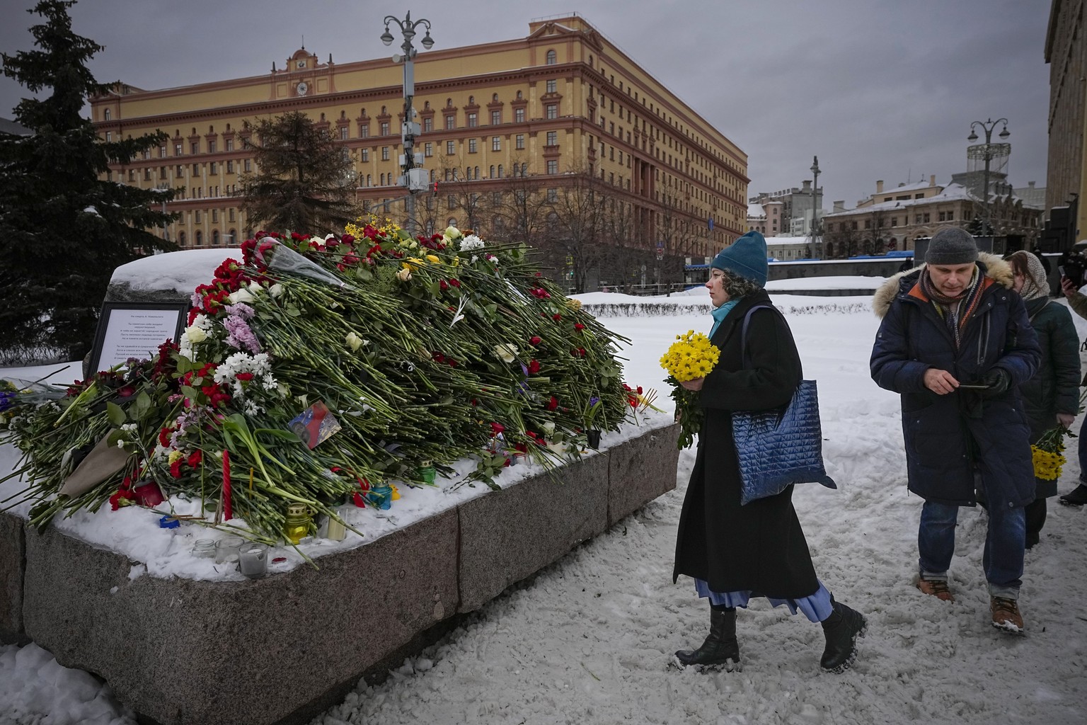 People lay flowers paying the last respect to Alexei Navalny at the monument, a large boulder from the Solovetsky islands, where the first camp of the Gulag political prison system was established, wi ...