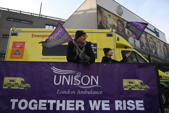epa10459083 Workers at a picket outside the London Ambulance Service in London, UK, February 10, 2023. NHS ambulance workers in London, Yorkshire, North West services run for the fourth ...