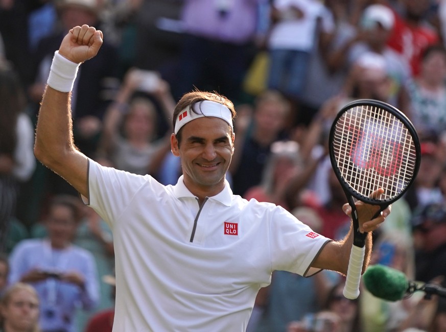 epa07708463 Roger Federer of Switzerland celebrates winning against Kei Nishikori of Japan during their quarter final match for the Wimbledon Championships at the All England Lawn Tennis Club, in Lond ...