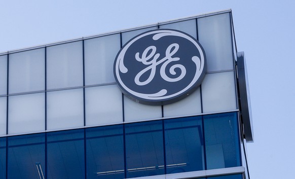 FILE - In this Jan. 16, 2018, file photo, the General Electric logo is displayed at the top of their Global Operations Center in the Banks development of downtown Cincinnati. General Electric Co. repo ...