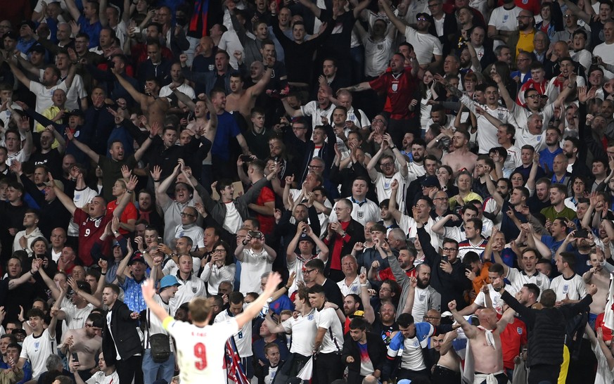 England&#039;s Harry Kane celebrates with fans after winning the Euro 2020 soccer championship semifinal match between England and Denmark at Wembley Stadium in London, Wednesday, July 7, 2021. (Andy  ...