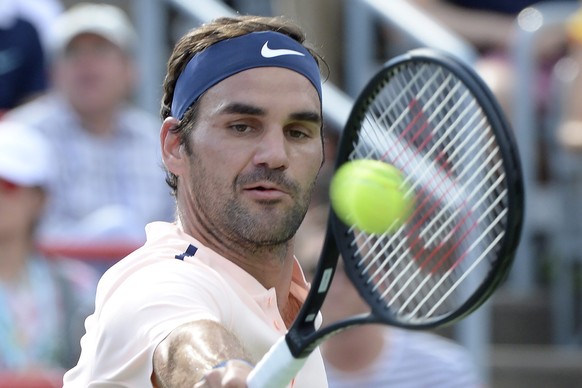 Roger Federer, of Switzerland, hits a backhand to Alexander Zverev, of Germany, during the final of the Rogers Cup tennis tournament Sunday, Aug. 13, 201, in Montreal. (Paul Chiasson/The Canadian Pres ...