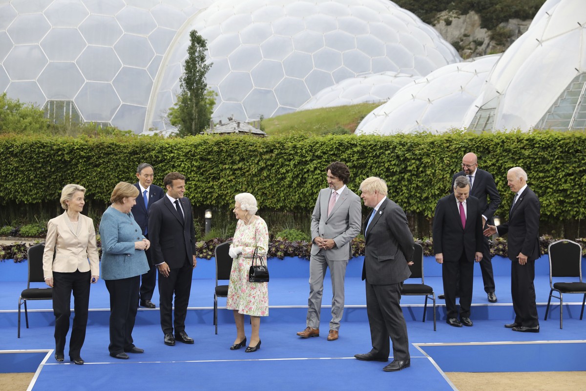 Britain's Queen Elizabeth II talks with G7 leaders, from left, back row, President of the European Commission Ursula von der Leyen, German Chancellor Angela Merkel, Japan's Prime Minister Yo ...